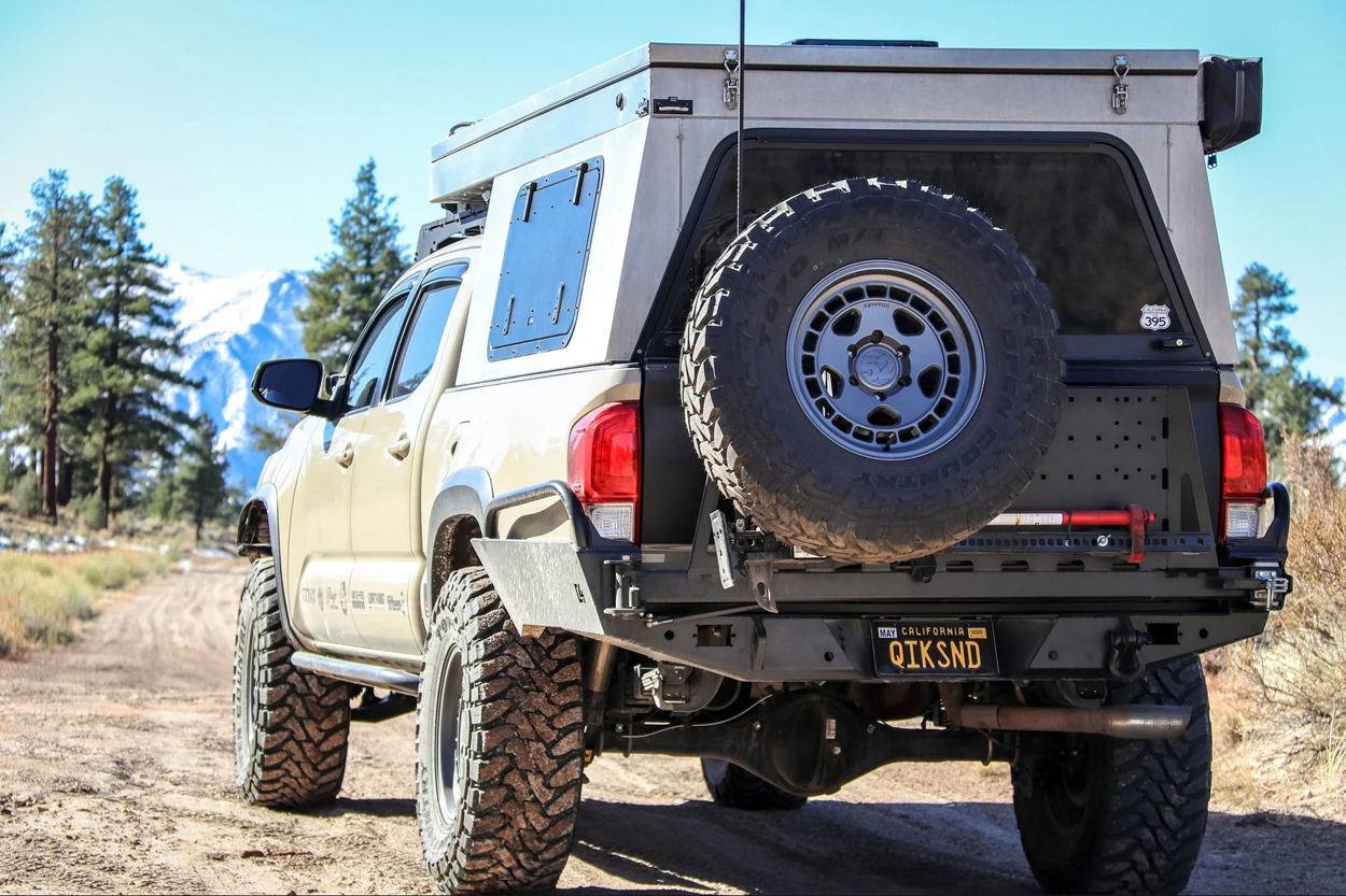 C4 Fabrication High Clearance Dual Swingout Rear Bumper on 3rd Gen Tacoma with Pop-Up Style Camper, Full Size Spare Tire, Hi-Lift Jack Mount, and Overland Awning