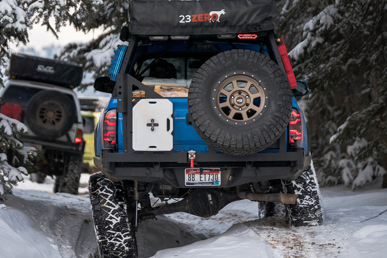 CBI Off-Road Rear Bumper With Integrated Dual Swingout Full-Sized Spare Tire Carrier and Rotopax Fuel Container Mount on Voodoo Blue 3rd Gen Tacoma Overland Build