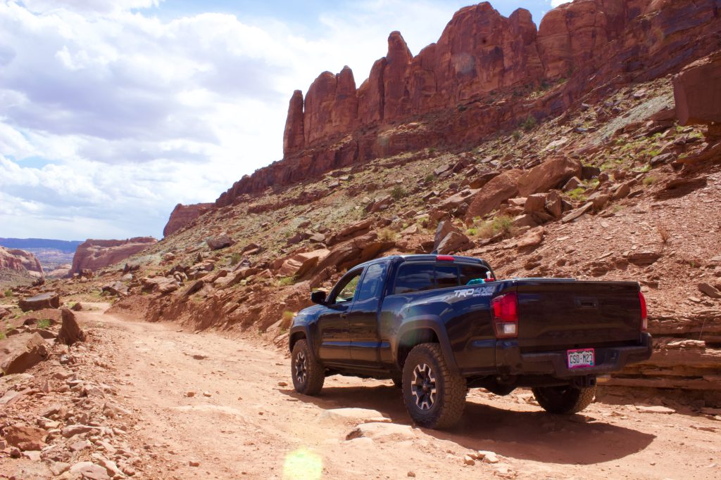 Black Toyota Tacoma TRD Off-Road on Gemini Bridges Moab 4x4 Trail