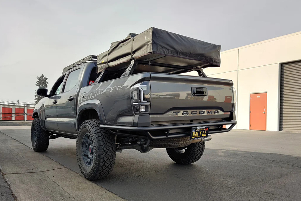 Outgear Solutions Baja Style Tube Rear Bumper on Magnetic Gray Metallic 3rd Gen Tacoma With Aftermarket Tail Lights, Bed Rack and Rooftop Tent, and Prinsu Roof Rack