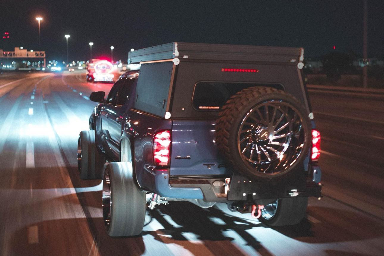 Lifted 3rd Gen Tacoma Show Truck w/ Rock Lights On Highway