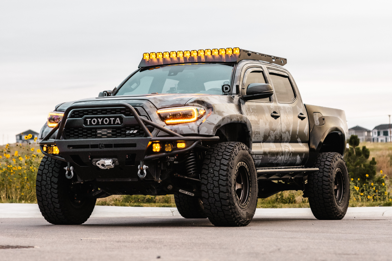 Lifted Long Travel 3rd Gen Tacoma With C4 Fabrication Hybrid Bumper, Amber Lighting, Custom Vinyl Wrap, Dirt King Long Travel & Fiberglass Fenders