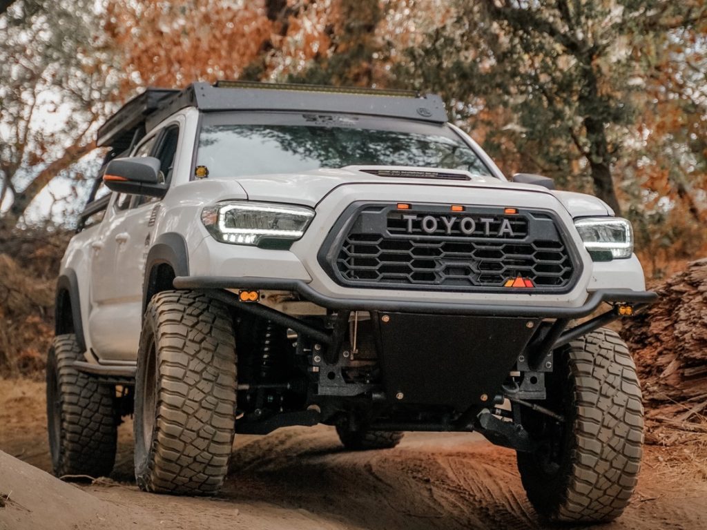 Lifted White Tacoma With Custom Prerunner Front Bumper & BFG KM3s