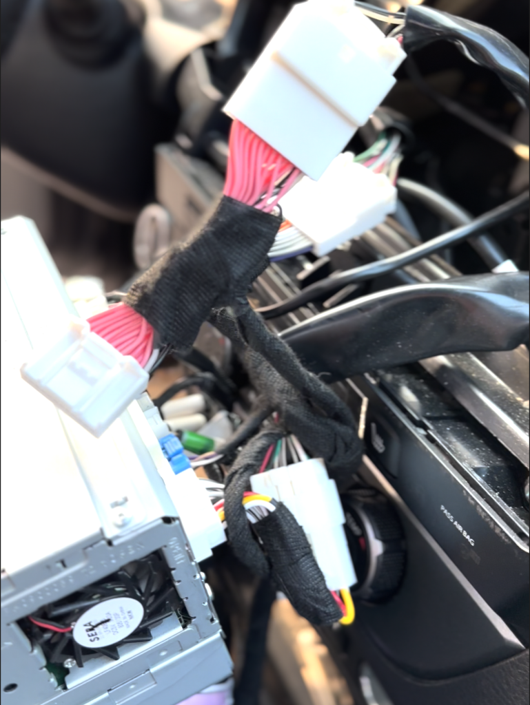OEM Toyota Tacoma wiring connected to the CARabc 3 prong adapter