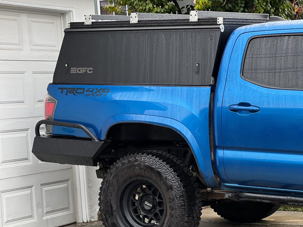 Black GFC Topper With Beef Bars On Blue Tacoma