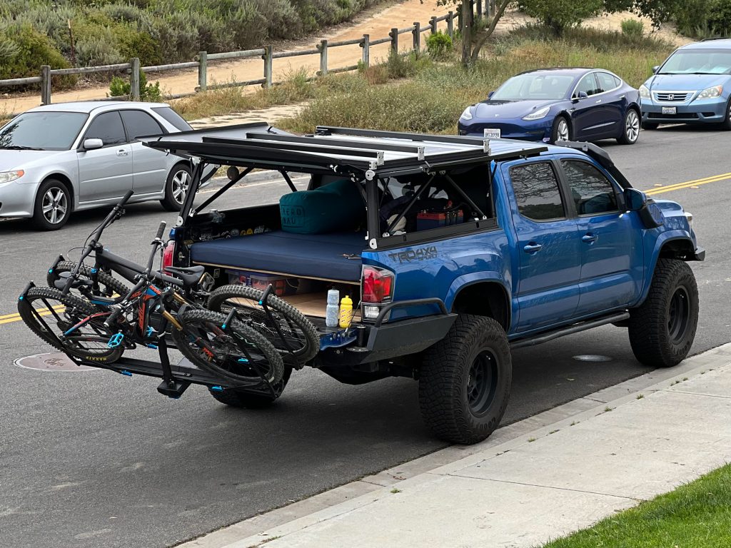 GFC Platform Topper on a 3rd Gen Tacoma RockyMounts GuideRail Bike Rack with Two Bikes Folded Down