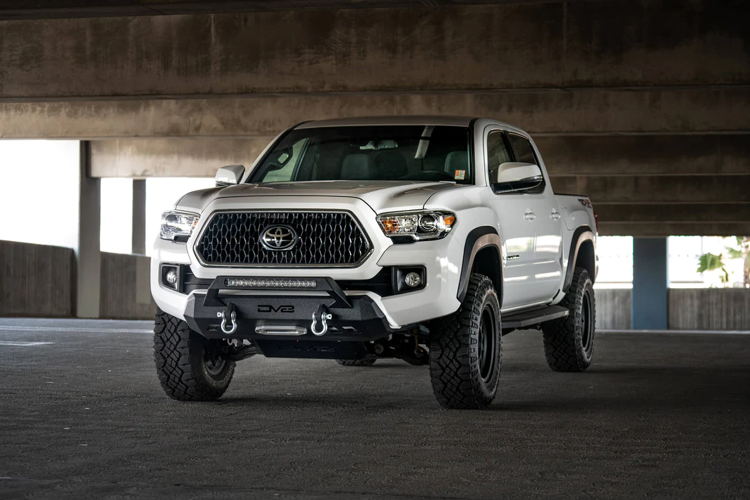 DV8 Offroad Tacoma low profile front bumper parked in a parking garage