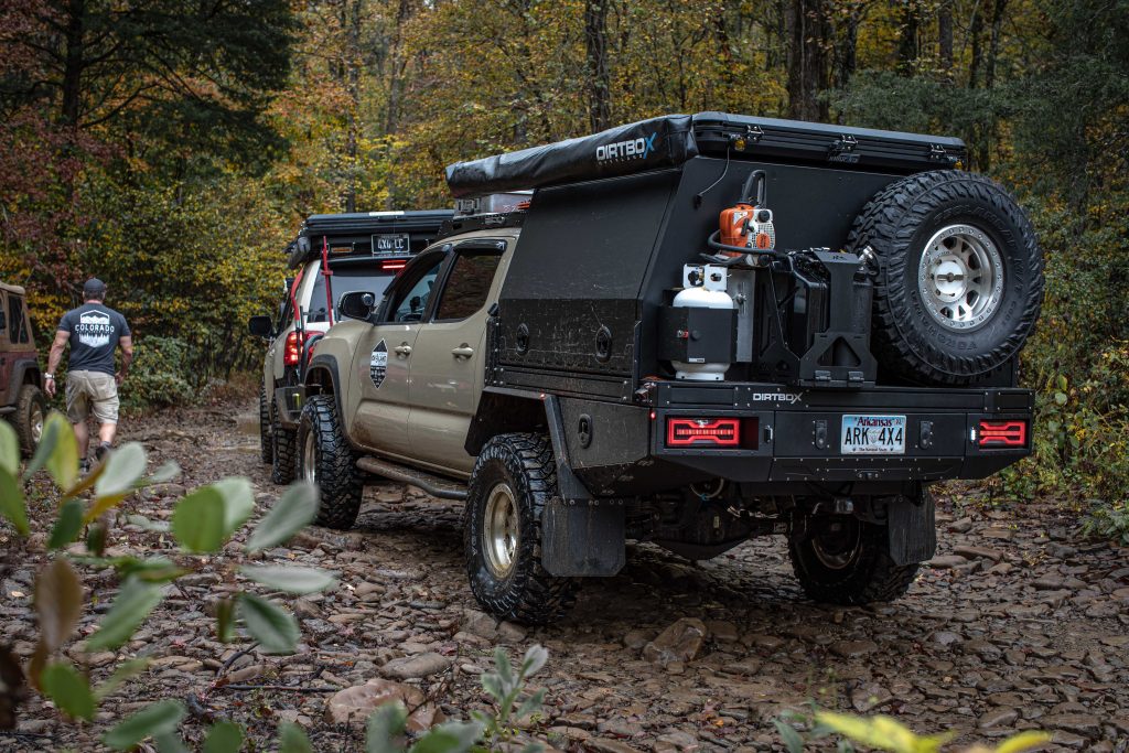 Dirtbox Overland Canopy With Propane Can, Chainsaw, Spare Tire, Backwoods Adventure Mods Carrier Jerry Can
