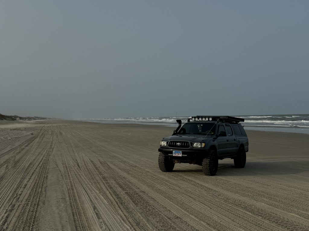 Toyota Tacoma Overlander Rig On Sandy Beach 