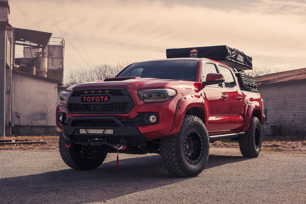 Body Armor 4x4 Tacoma low profile front bumper on red 3rd gen Tacoma overland build