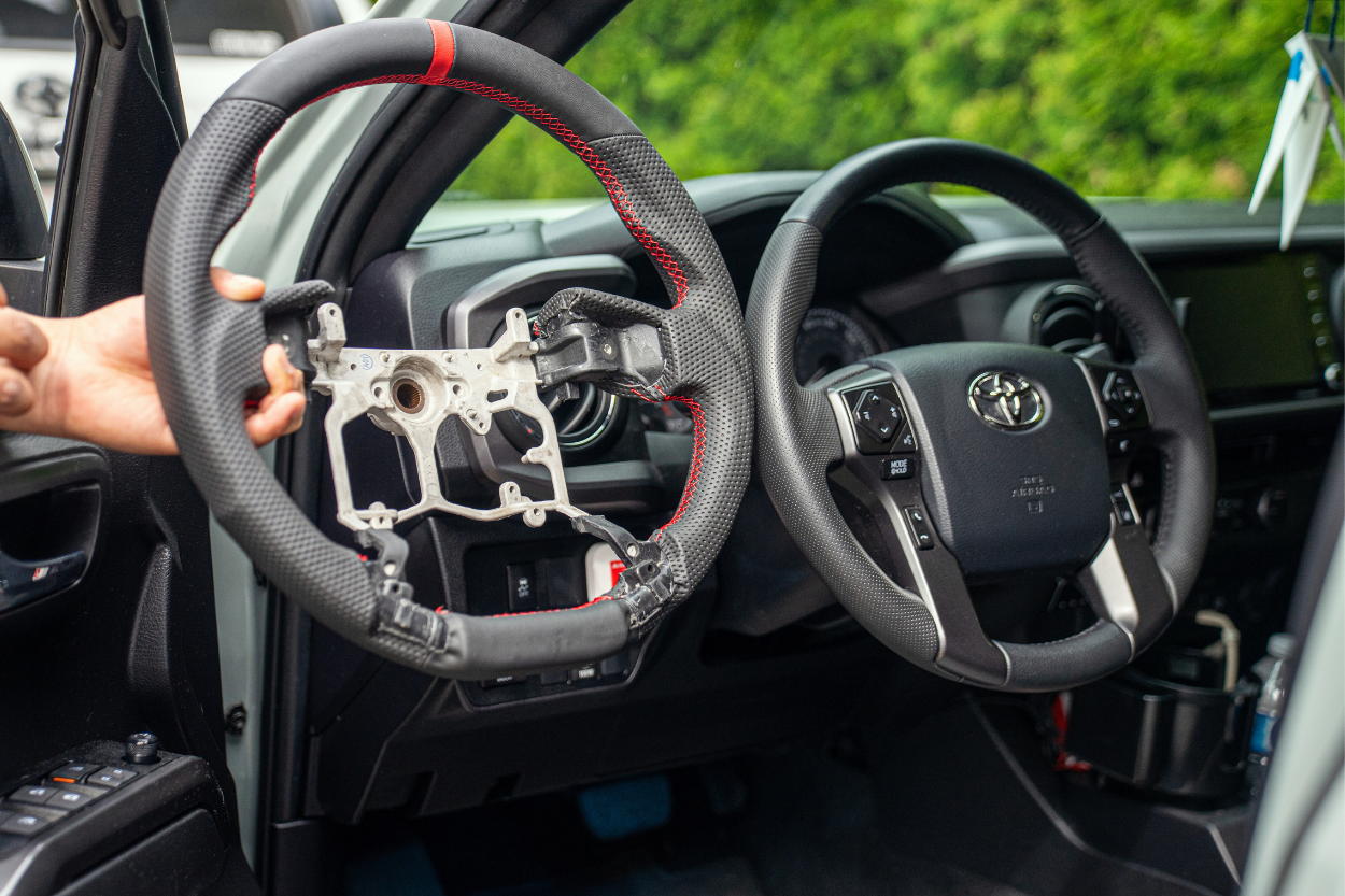 Leather Steering Wheel With Race Stripe Vs. OEM Steering Wheel