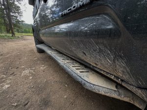 Backwoods Adventure Mods 2nd & 3rd Gen Tacoma Rock Sliders getting muddy on the trail.