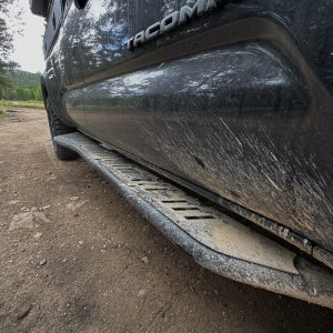 Backwoods Adventure Mods 2nd & 3rd Gen Tacoma Rock Sliders getting muddy on the trail.