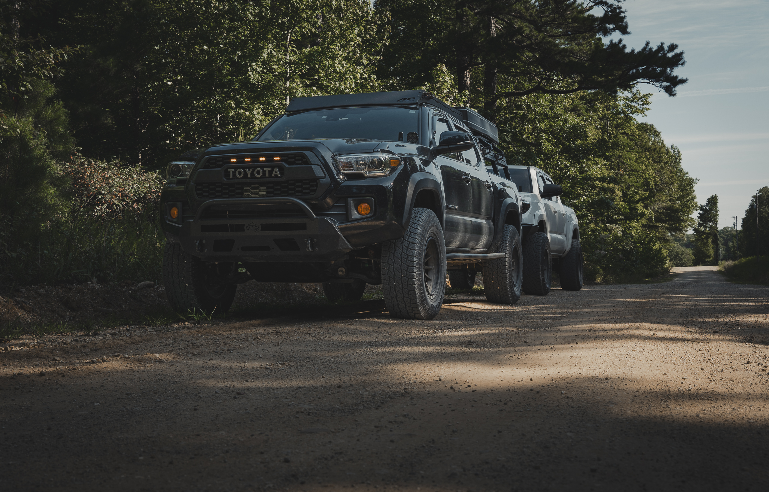 Tacoma on a dirt road with Arroyo Tamarock All-Terrain Tires