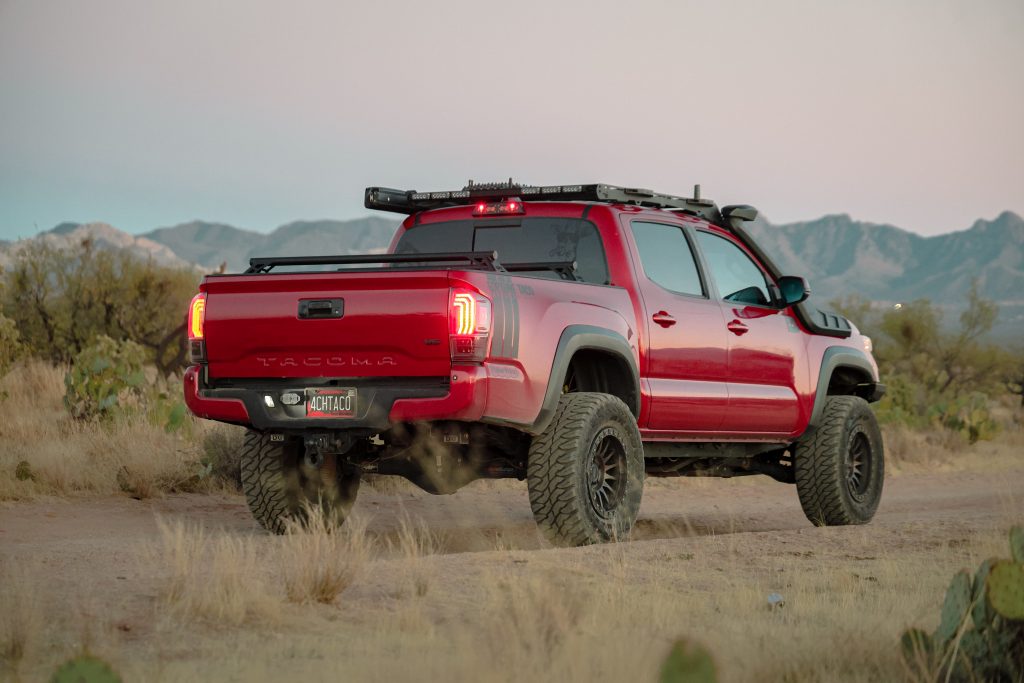 Red 3rd Gen Tacoma With Black Morimoto Tail Lights