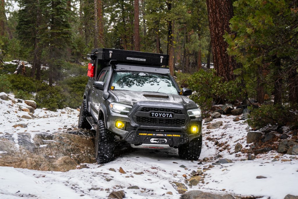 Overland Built Tacoma Snow Wheeling In The Rocks